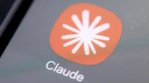 Reuters A close-up image of Claude's phone app logo.