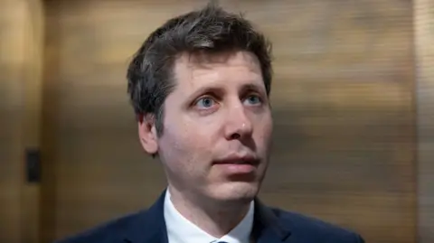 Reuters OpenAI chief Sam Altman answering questions in a hallway during a trip to Washington DC.