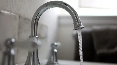 Getty Images Water falls from a tap