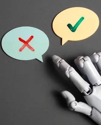 Robot hand pointing to speech bubbles with a check mark and an "X" mark