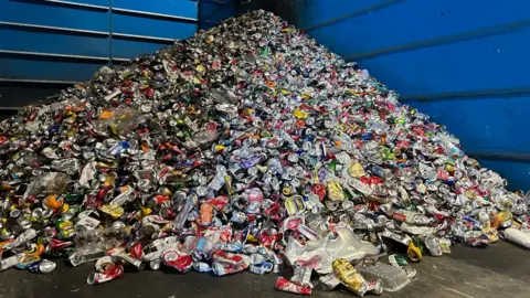 A mountain of crushed cans and other metal containers at the Vale of Glamorgan Council's recycling facility in Barry