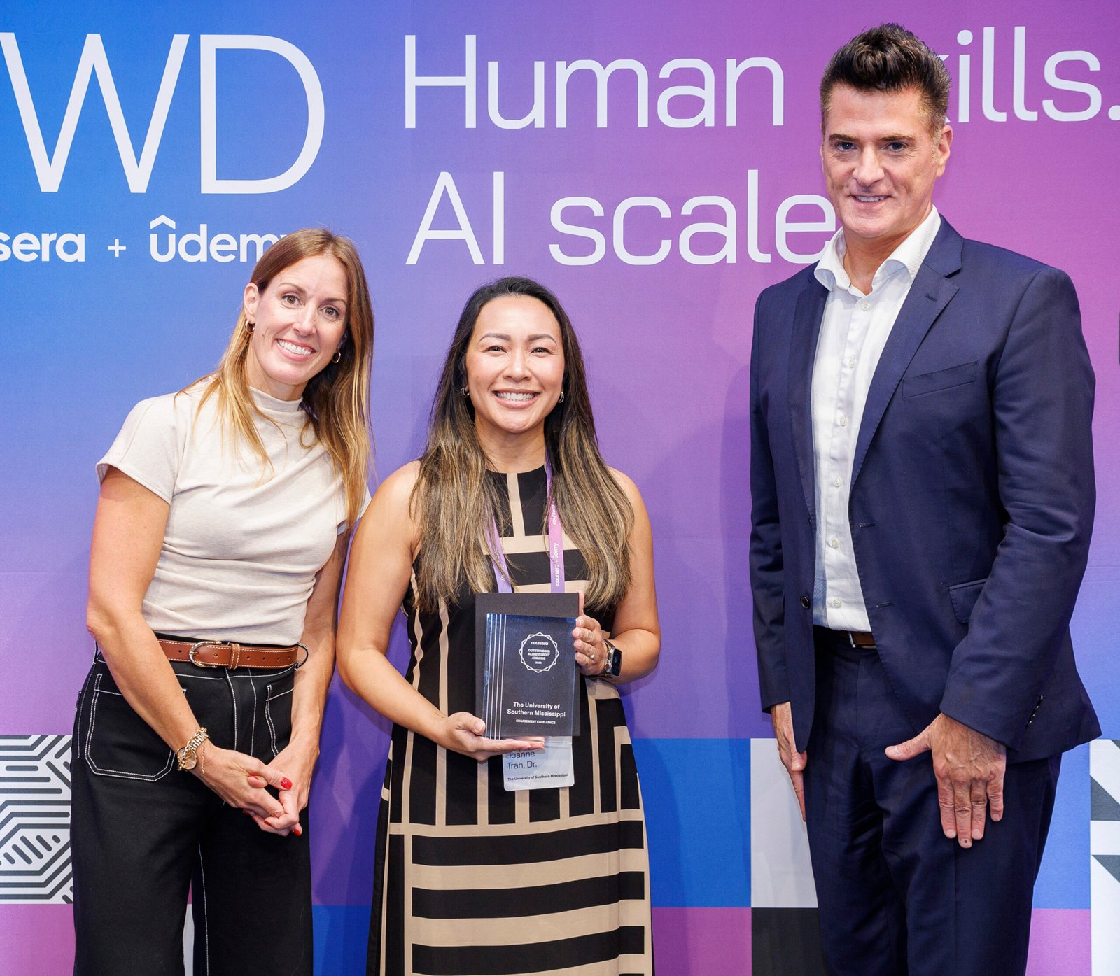 Dr. Tran accepts Coursera award